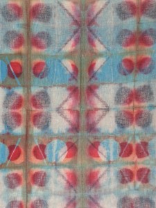 This shibori-clamped fabric was discharged three times and dyed three times.  