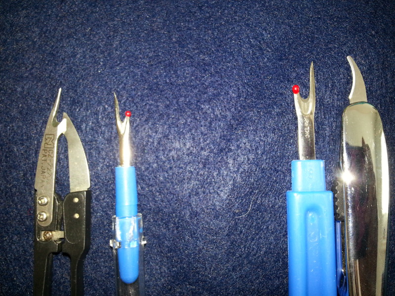 The 2 seam rippers on the left work best for ripping out stitches.  The other work to cut thread.  